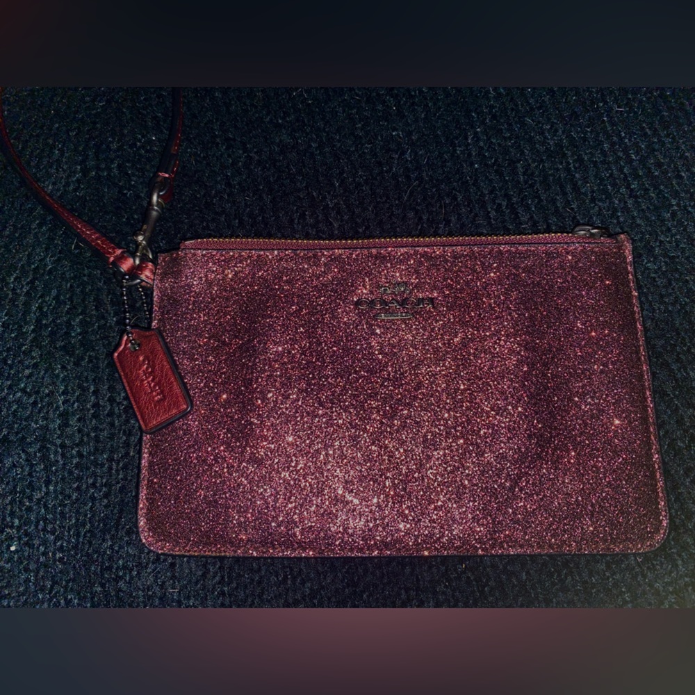 Authentic COACH cherry red glitter wrist slit bag